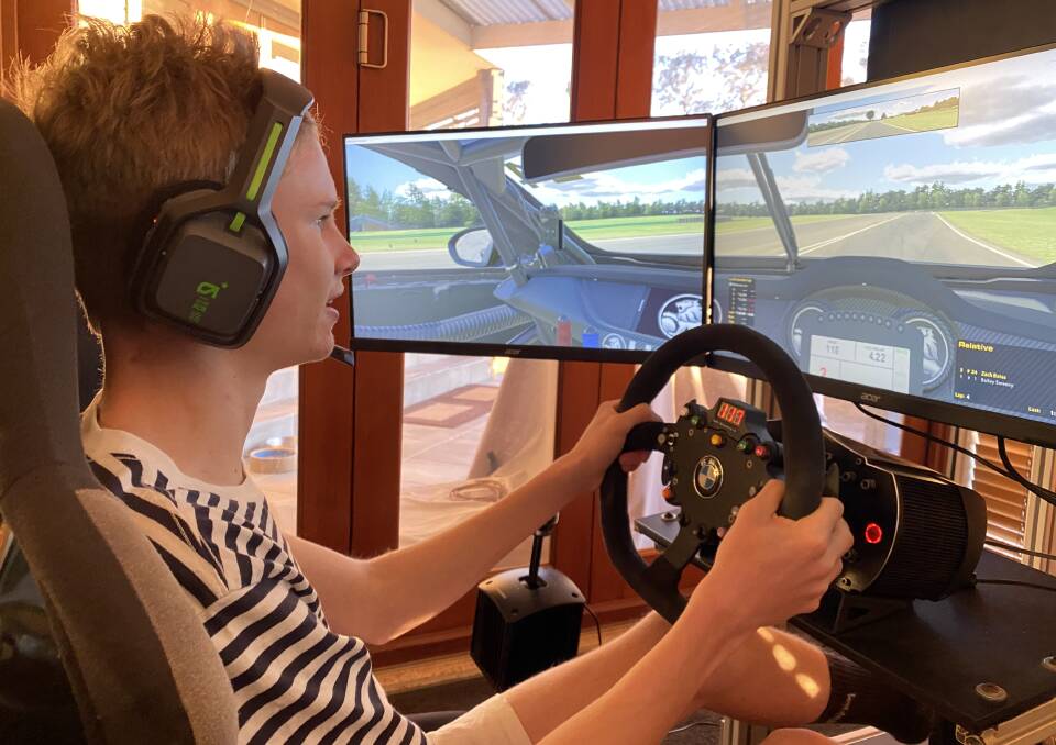 Zach Bates at home on his race simulator. Picture: Supplied