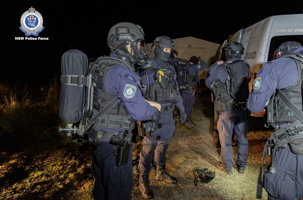 Police assemble in readiness for the pre-dawn raid near Marulan. Picture supplied