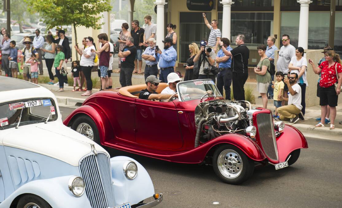 Modified cars cruise the city street during Summernats. Picture: Dion Georgopoulos