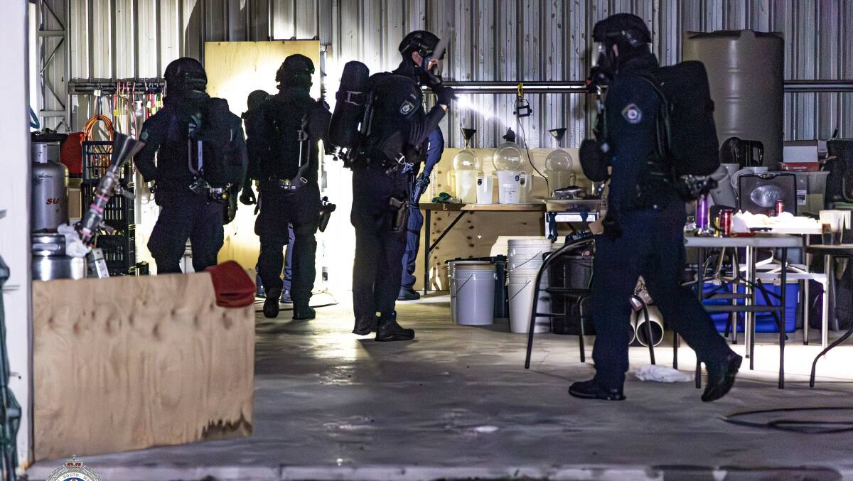 Tactical police wore breathing apparatus when they raided the industrial shed near Marulan. Picture supplied 