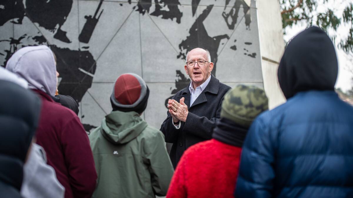 Sir Peter Cosgrove, in Canberra for the 50th commemoration of the end to the Vietnam War, with his student audience at the Anzac Avenue memorial. Picture by Karleen Minney 