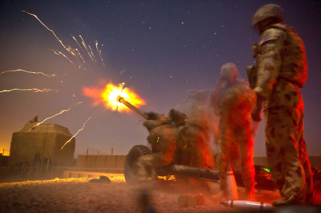 Gunners from 1st Field Regiment fire an illumination round in support of British ground forces in Helmand Province, Afghanistan. Picture: ADF