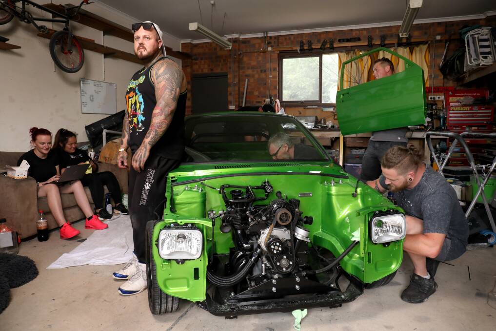 In a tiny Monash garage, Spike Dickson and his mates rush to have the radical little Mighty Boy ready for its Summernats debut. Picture by James Croucher 
