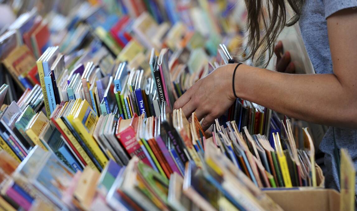 Searching through the books at the Lifeline book fair. picture: Dion Georgopoulos
