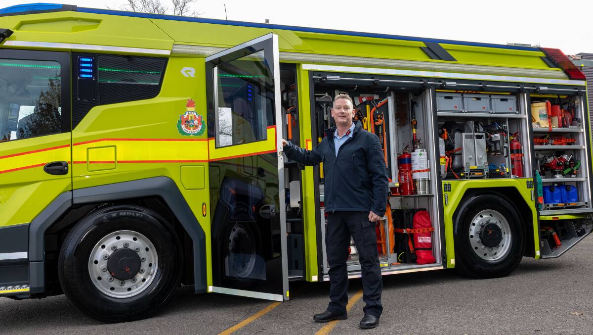 ACT Chief Fire Officer Matt Mavity with the ESA's new hybrid-electric fire pumper. Picture by Gary Ramage 