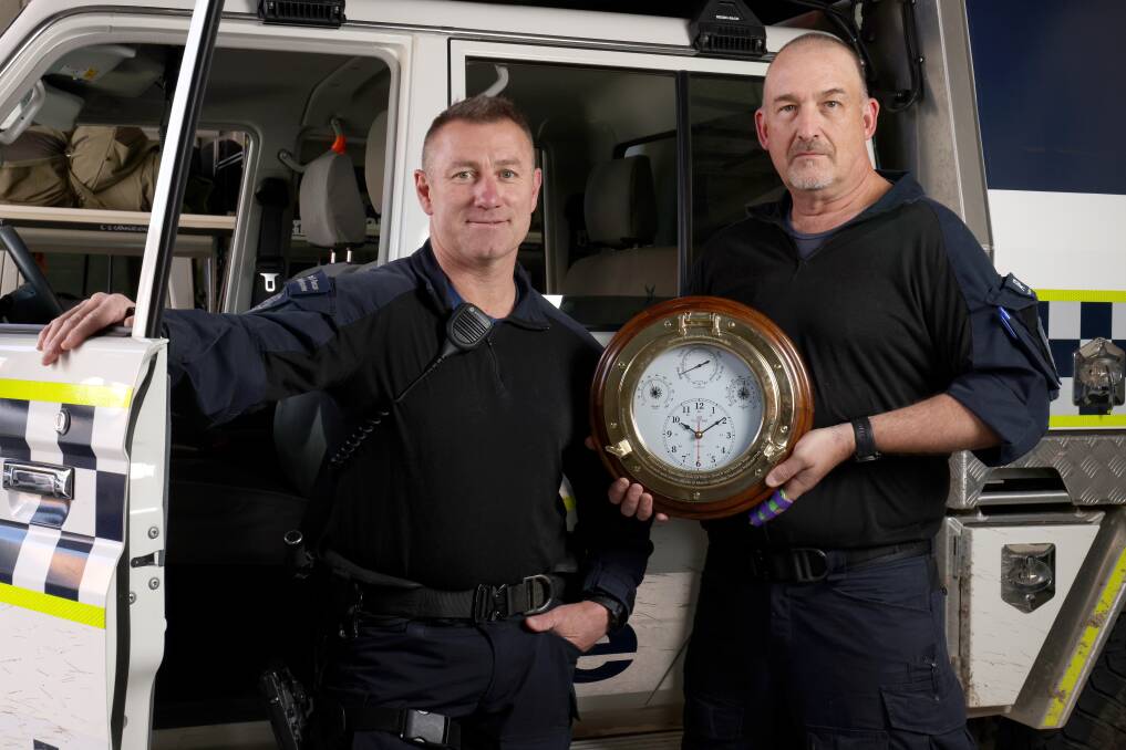 Snr Constable Paul Yates and Sergeant Andrew Craig with the national search and rescue award for their Mt Gudgenby rescue. Picture by James Croucher