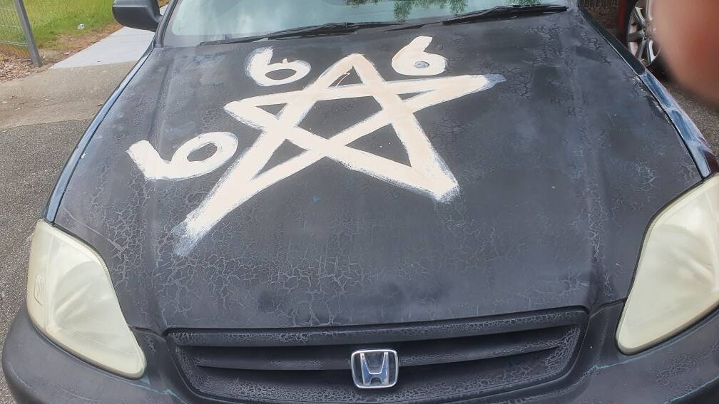 Graffiti has been sprayed on ACT Housing tenants' cars at the Wanniassa housing complex. Picture supplied