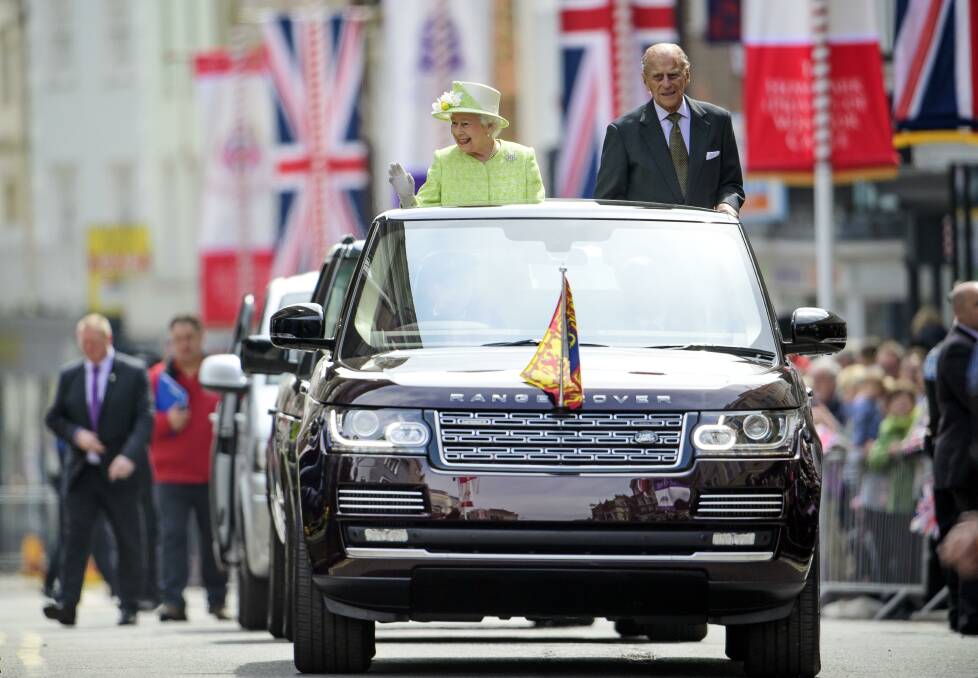 The Queen and Prince Phillip in one of the many modified State Review Range Rovers produced for special occasions. Picture supplied