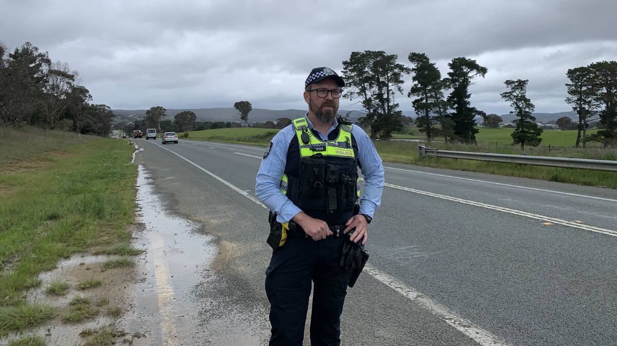 Acting Sergeant Will Stevenson, from the ACT collision investigation team, on the stretch of road where Jyle Molloy-Murphy's body was found. Picture by Peter Brewer 
