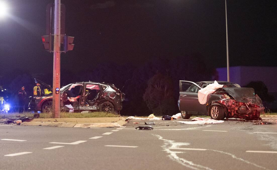 Gungahlin Drive was closed for several hours on the evening of Easter Saturday after a two-car collision. Picture by Keegan Carroll