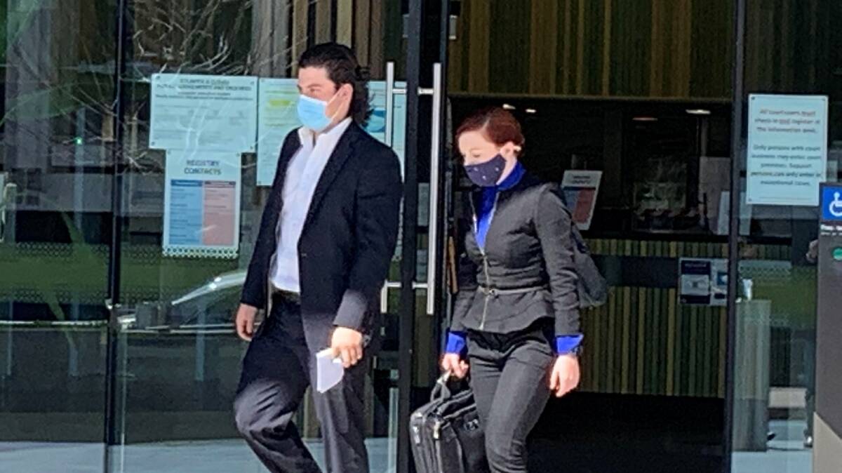 Joshua Cannizzaro, left, leaving court with a legal representative. Picture: Peter Brewer