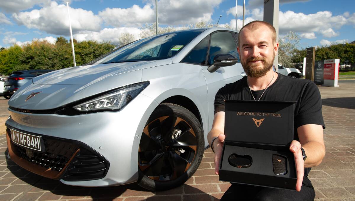 Elliott Morgan, Cupra Canberra's 'master', with the 'welcome to the tribe' carbon fibre bracelet and key kit that new customers to the Spanish brand receive. Picture by Elesa Kurtz 