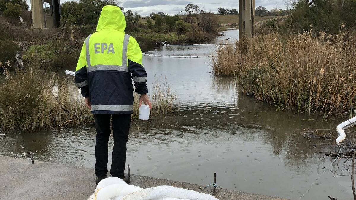 A NSW EPA officer monitors the Molonglo River spill. Picture: NSW EPA 