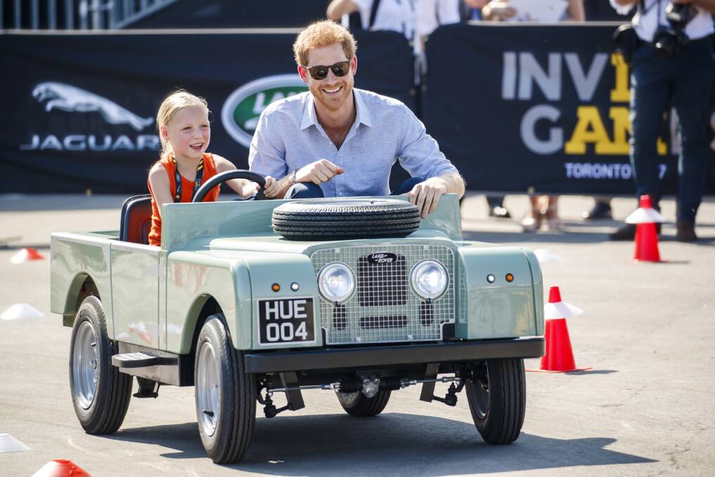 Prince Harry in a mini-Land Rover at the start of the Invictus Games. Picture supplied