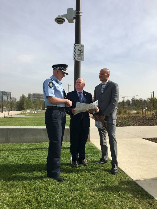 Chief police officer Ray Johnson, left, with ACT police minister Mick Gentleman and ACT government security branch manager Bren Burkevics at the CCTV camera launch. Picture: Peter Brewer