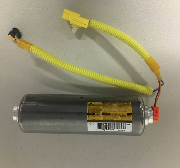 A faulty, killer Takata explosive inflator used to deploy a passenger's side airbag. Picture: Peter Brewer 
