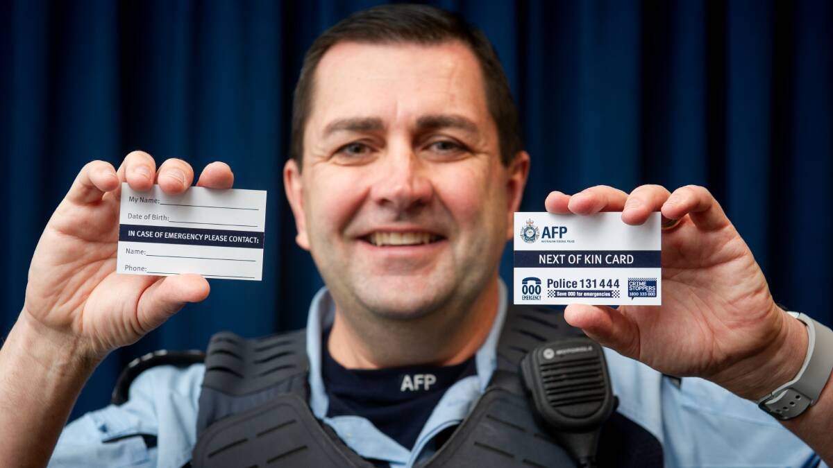 Sergeant Ben Willis with the next-of-kin cards, available from all police stations. Picture Elesa Kurtz