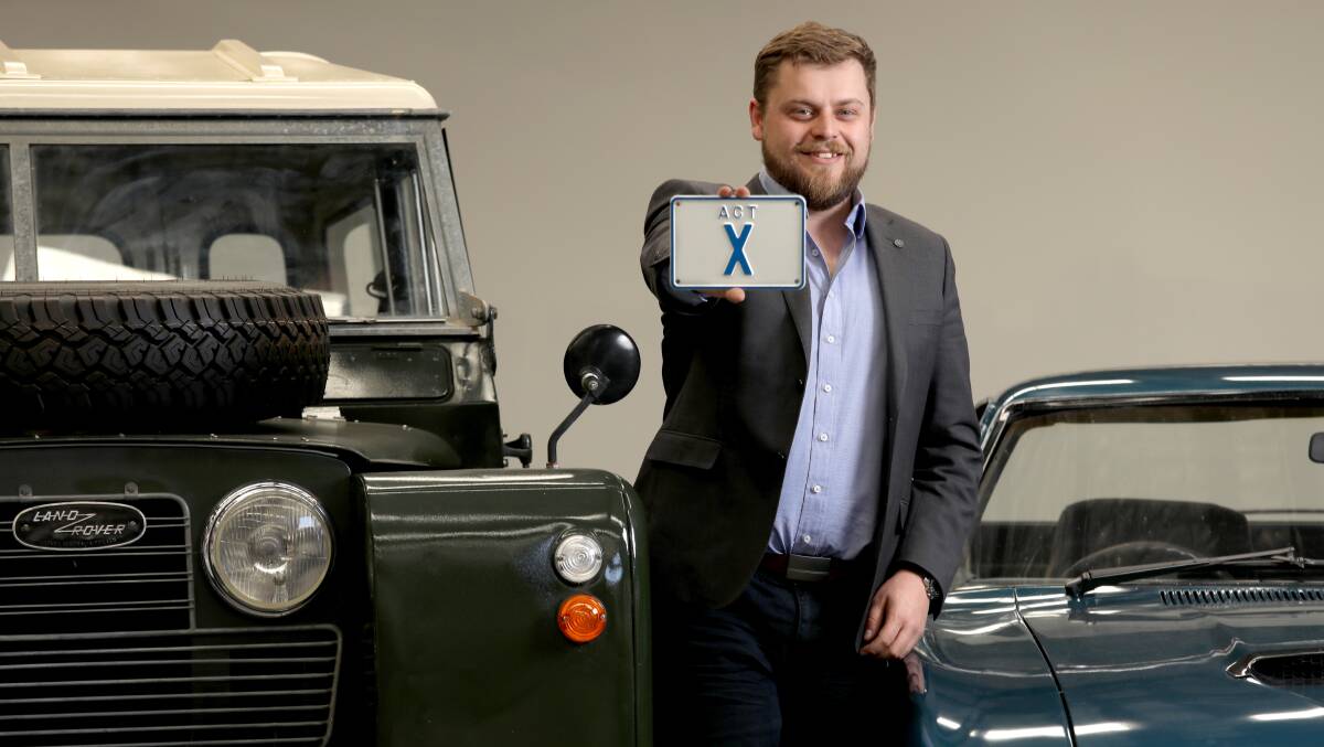 AllBids group general manager Ben Hastings with the single-letter X plate, which soared to an ACT record price of $147,200 this week. Picture by James Croucher