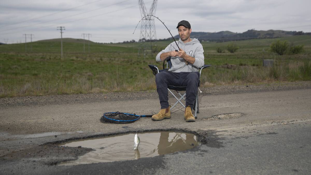 When Ben Wilkie, of Fraser, went fishing in a pothole. Picture by Keegan Carroll 