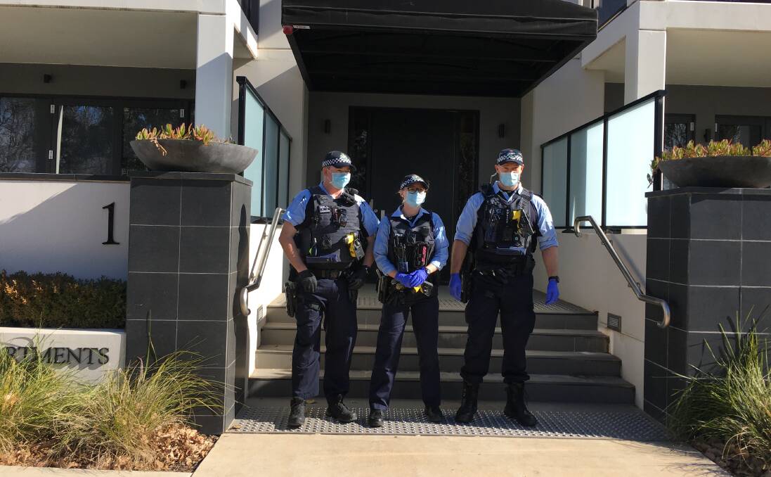 Covid compliance officers outside the Burberry apartments in Kingston. Picture: Peter Brewer