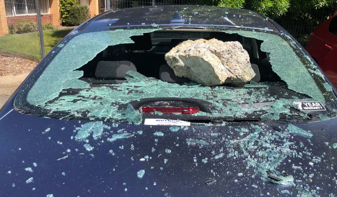 A concrete block was thrown through a car's back window. Picture supplied
