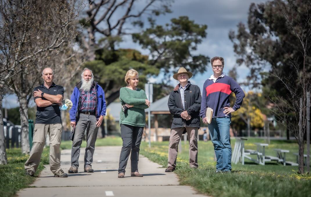 From left, Cliff Cole, Mark Lintermans, Carolyn Cole, Richard Gregory and Stuart Gregory from the Save the Bungendore Park group. Picture: Karleen Minney