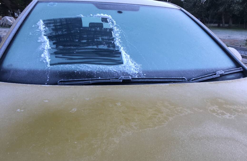 Police warn drivers to clear frost completely before driving off. Picture: Peter Brewer 