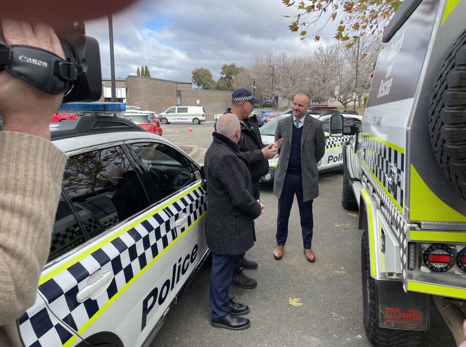 Police Minister Mick Gentleman and Chief Minister Andrew Barr receive a briefing around the functions of the new police search and rescue truck. Picture by Peter Brewer 