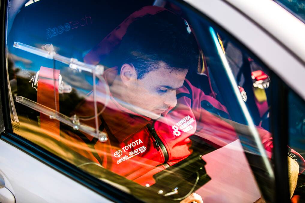 A study of concentration; champion rally co-driver John McCarthy works on his pace notes in the car ahead of the event. Picture: Jack Martin 