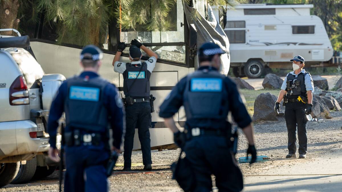 Police move into the Cotter campground on Monday afternoon. Picture: Sitthixay Ditthavong