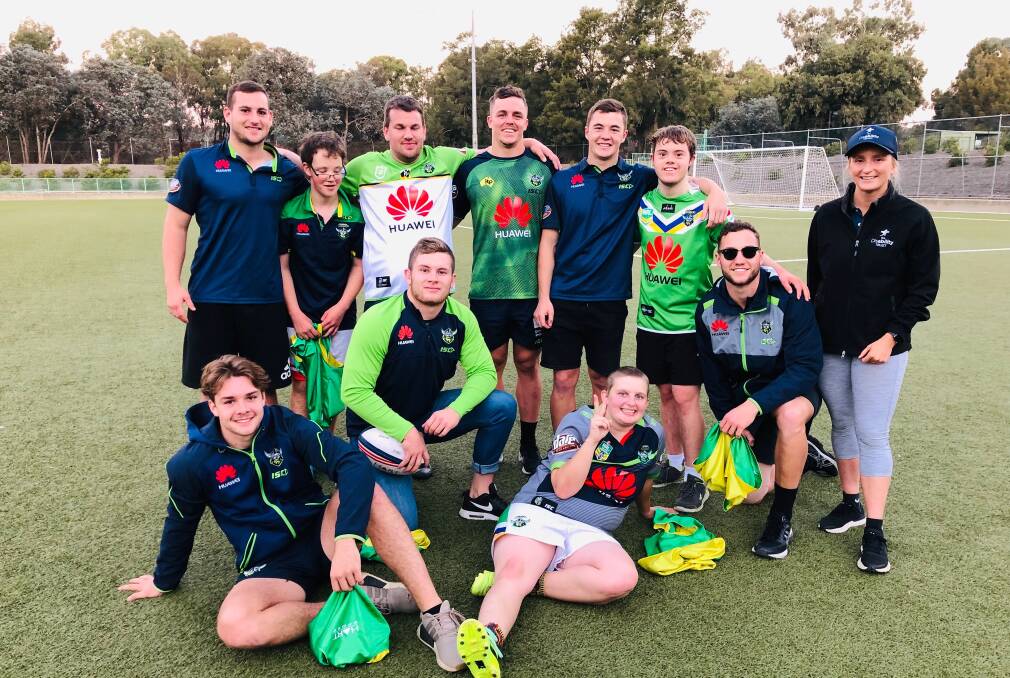 The Canberra Raiders under-20s players help launch The Disability Trust's Score Raiders rugby league program.