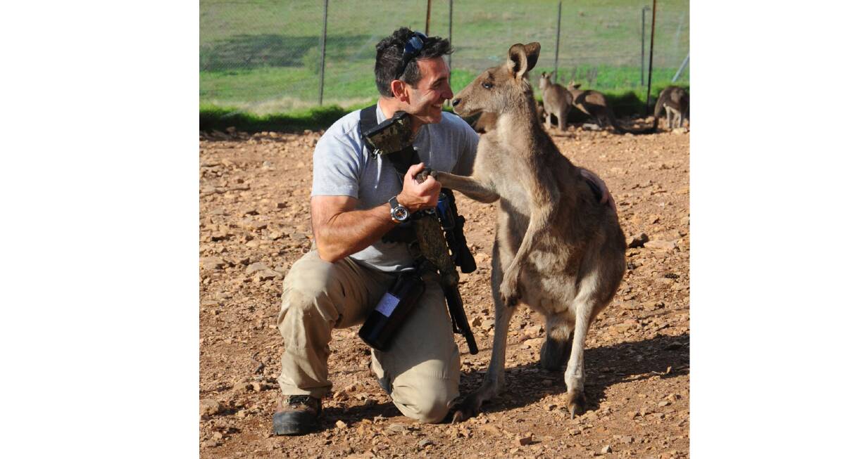Marcus Fillinger and a rescued animal. Picture: Supplied