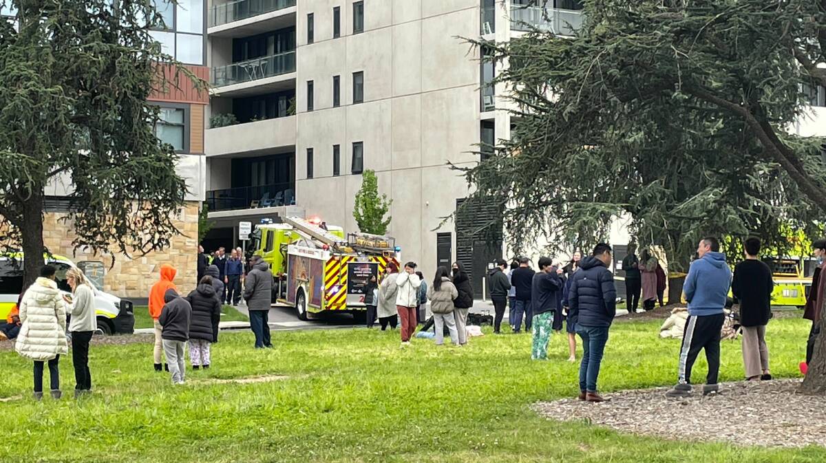 Residents were evacuated from a Braddon apartment block after a caravan caught fire in the basement carpark. Picture by Sitthixay Ditthavong