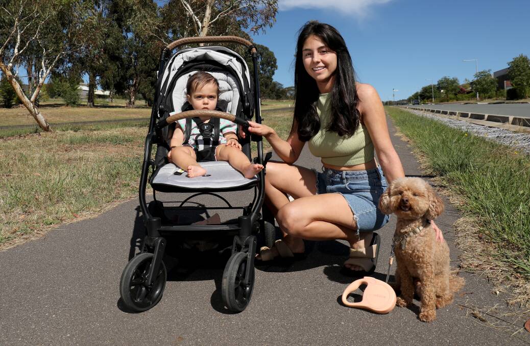 Talia Mihailakis walking in Wright with her daughter Pia and dog Sunny. Picture by James Croucher 