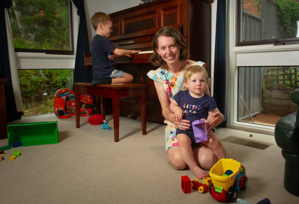 Kristy Bartlett with her children Ryan, 4 and Skye, 1, have switched from gas to electric appliances to benefit the environment. Picture by Elesa Kurtz