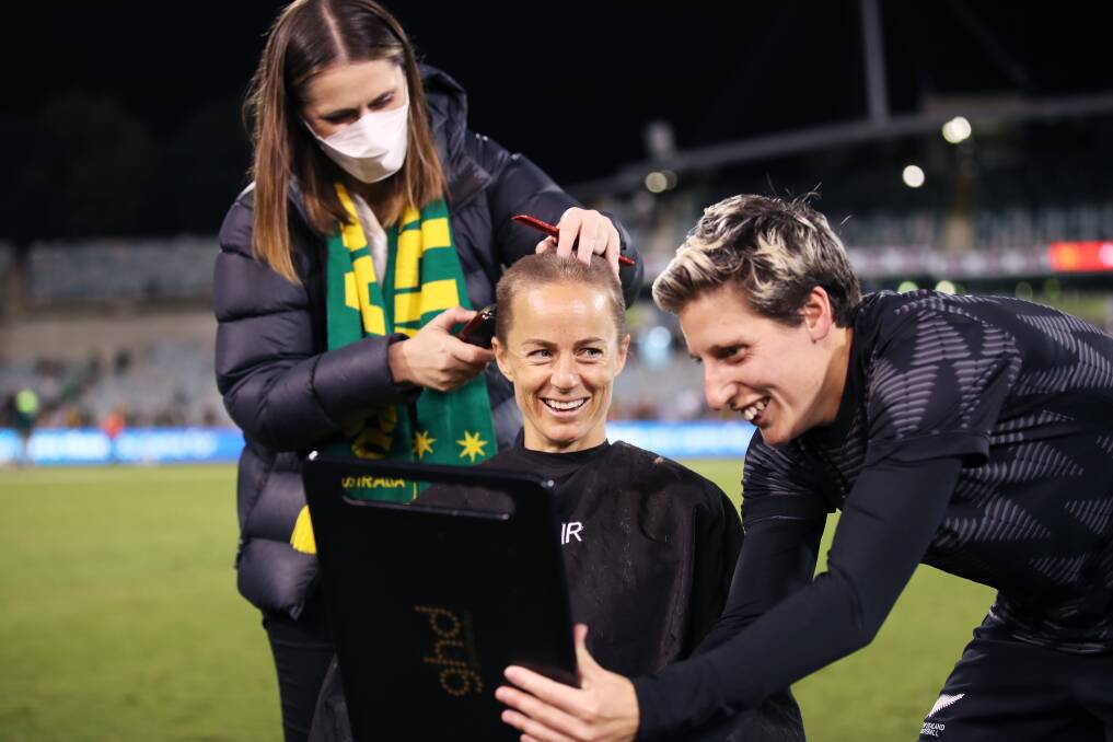 Aivi Luik of the Matildas has her head shaved by Rebekah Stott of New Zealand Ferns after the International women's friendly match between the Australia Matildas and the New Zealand at GIO Stadium. Picture: Getty Images 