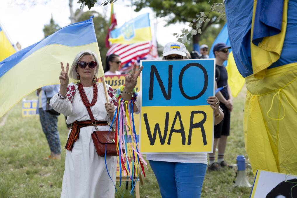 Pro-Ukraine protesters call for an end to the war outside the Russian embassy. Picture by Keegan Carroll