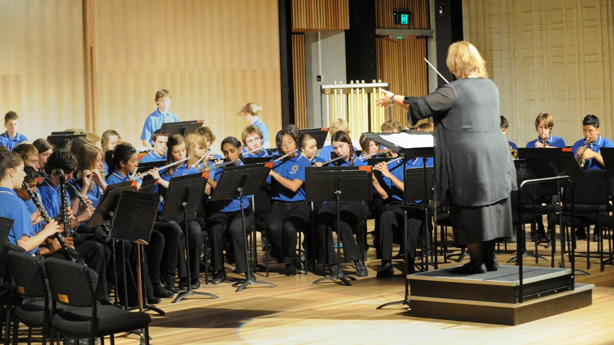 Debbie Masling conducts the Lyneham High School band at the opening of the Lyneham Performing Arts Centre in 2010. Picture by Richard Briggs 