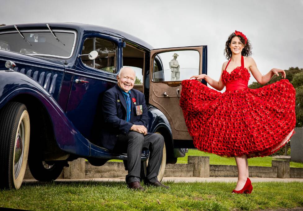 BEST DRESSED: Amira Nicholson wears the seven kilogram poppy dress with former Portland RSL president and Vietnam veteran David Cleary. Picture: Nicole Cleary