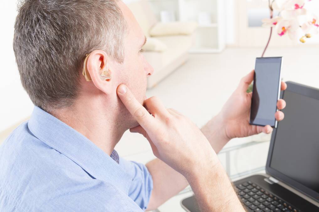 At your fingertips. Hearing aids are increasingly connecting with new technologies. Photo: Shutterstock.