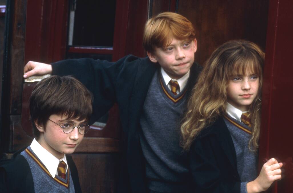 Harry (Daniel Radcliffe), Ron Weasley (Rupert Grint) and Hermoine Granger (Emma Watson) in Harry Potter and the Philosphers Stone. Picture: Warner Bros 2001.