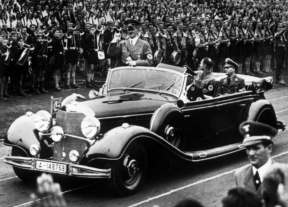 Adolf Hitler leaves a youth rally at Nuremberg stadium in September 1938. Picture: Sport and General Press Agency