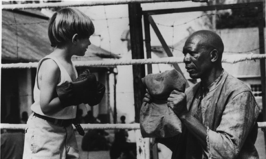 PK (Guy Witcher) is taught the finer points of boxing by Geel Piet (Morgan Freeman) in Warner Bros' The Power of One, a sweeping epic set in South Africa. 