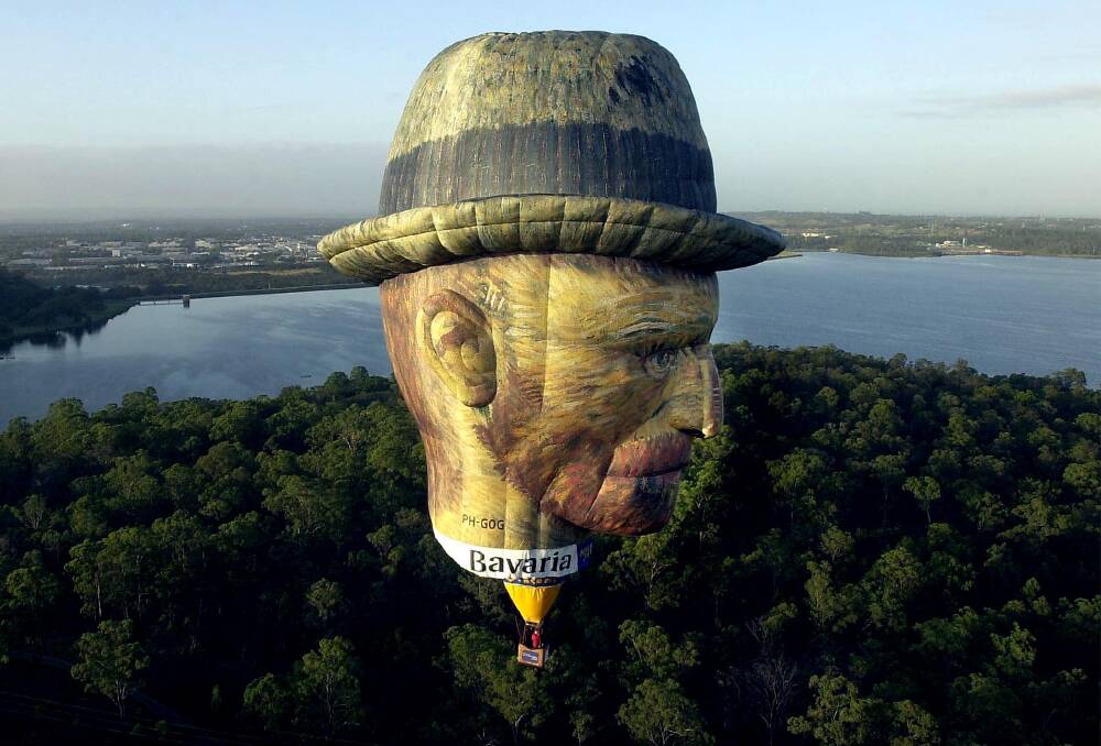 The Vincent Van Gogh balloon flies over Sydney in 2004 ahead of its appearance that year in Canberra. Picture: Graham Tidy.