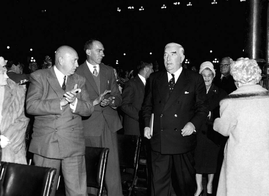 Prime minister Robert Menzies arrives at a Liberal Party rally at the Sydney Town Hall on 7 August 1961, during an election campaign he almost lost. Business leaders had been critical of his government's economic policies. Picture: Victor Wright 