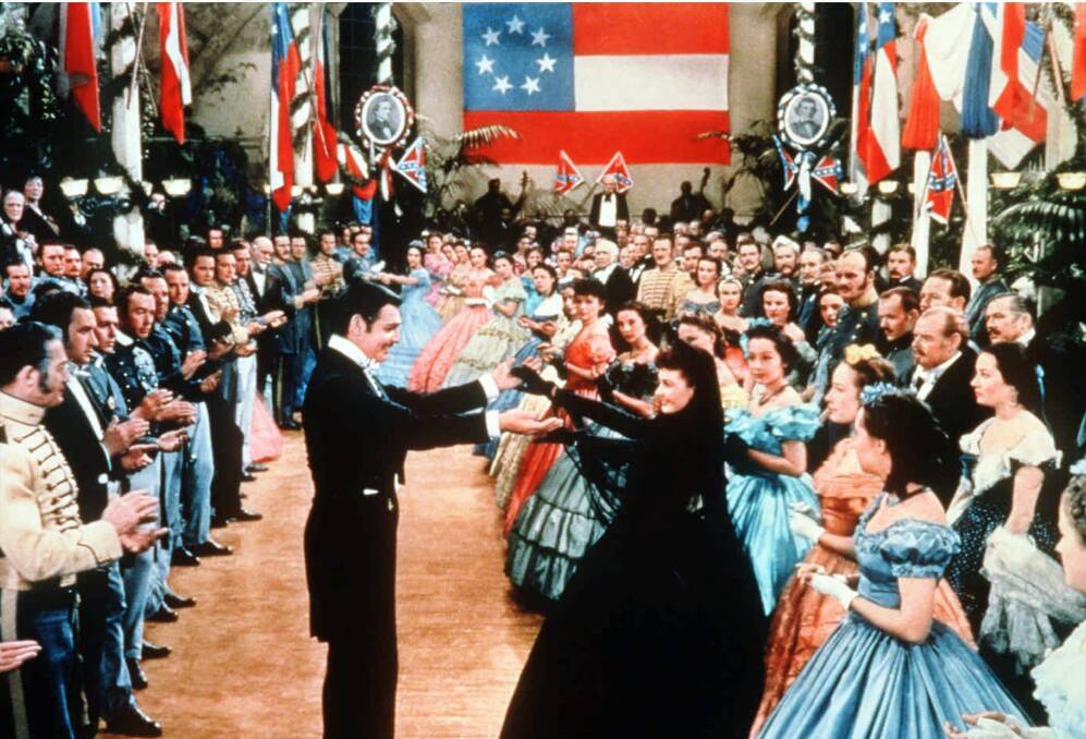Clark Gable, middle left, as Rhett Butler dances with Vivien Leigh as Scarlett O'Hara in Gone With the Wind Picture: AP Photo/New Line Cinema, File