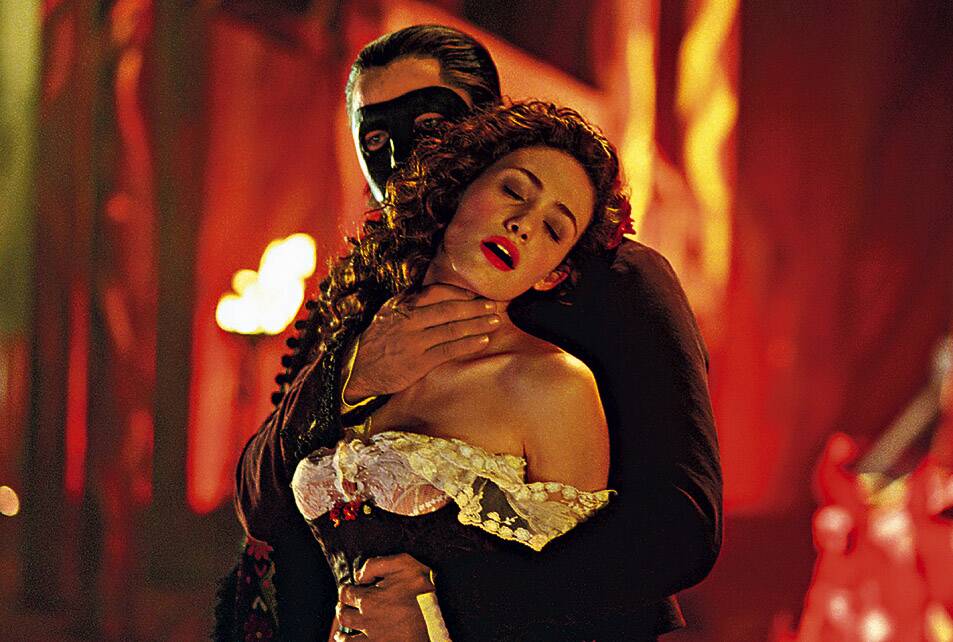 Gerard Butler, rear and Emma Rossum in The Phantom of the Opera. Picture: Supplied