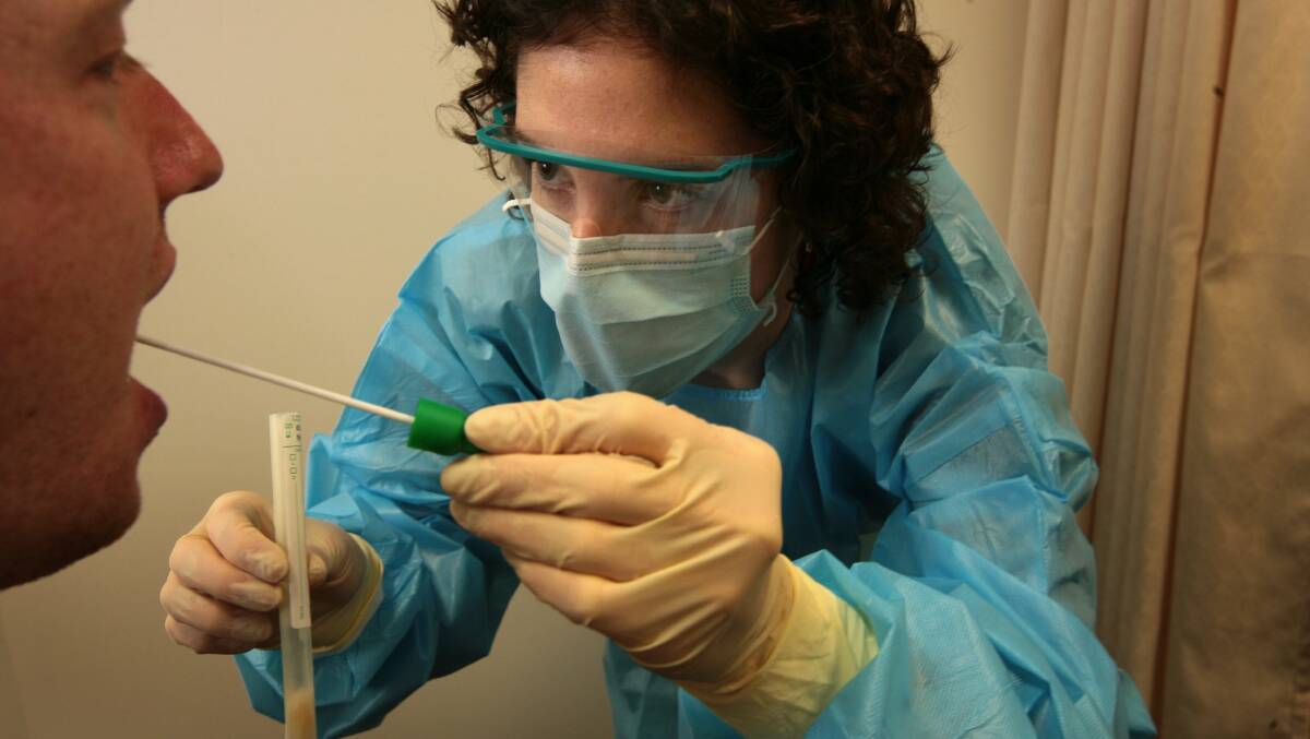 Dr Rebecca Shields takes a swab at the Northern Hospital flu clinic. Photo: Penny Stephens