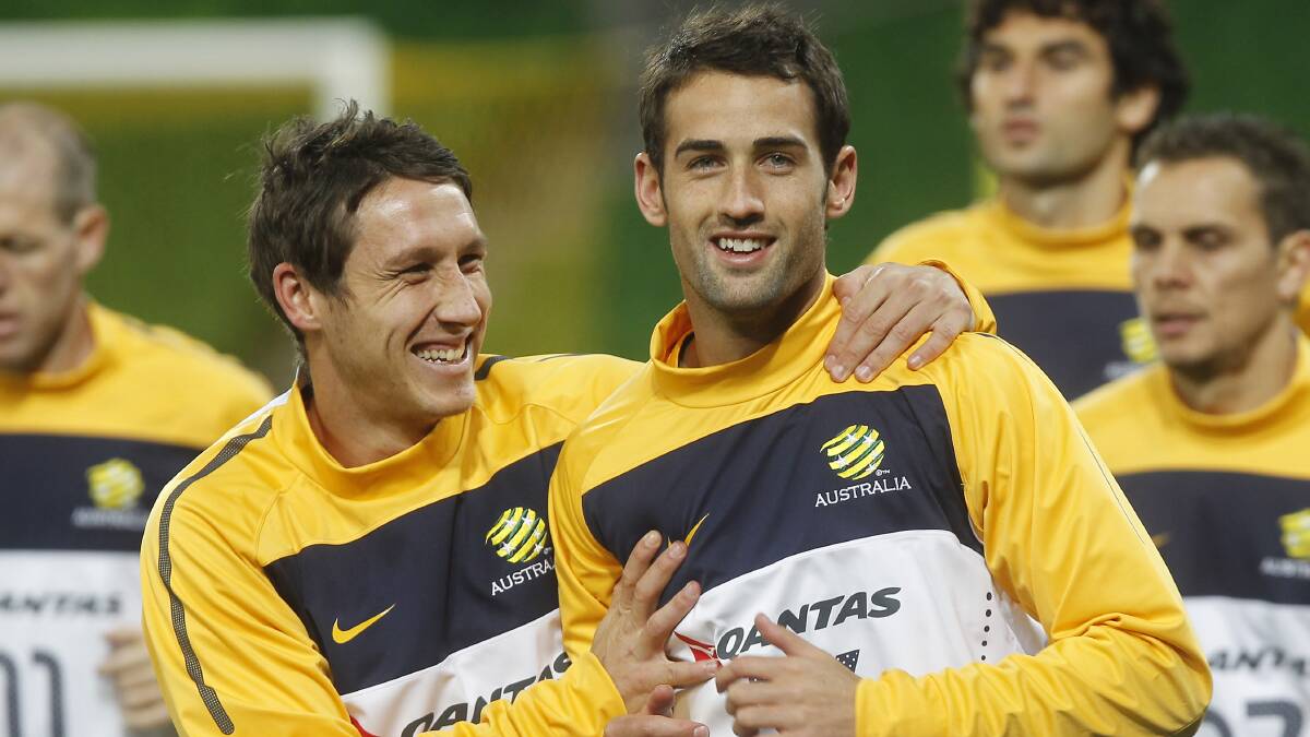 Mark Milligan and Carl Valeri share a joke at training before heading off to South Africa for the 2010 World Cup. Picture: Paul Rovere
