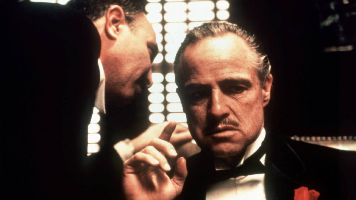 Marlon Brando, right, as Don Vito Corleone in The Godfather. Picture: Paramount Pictures